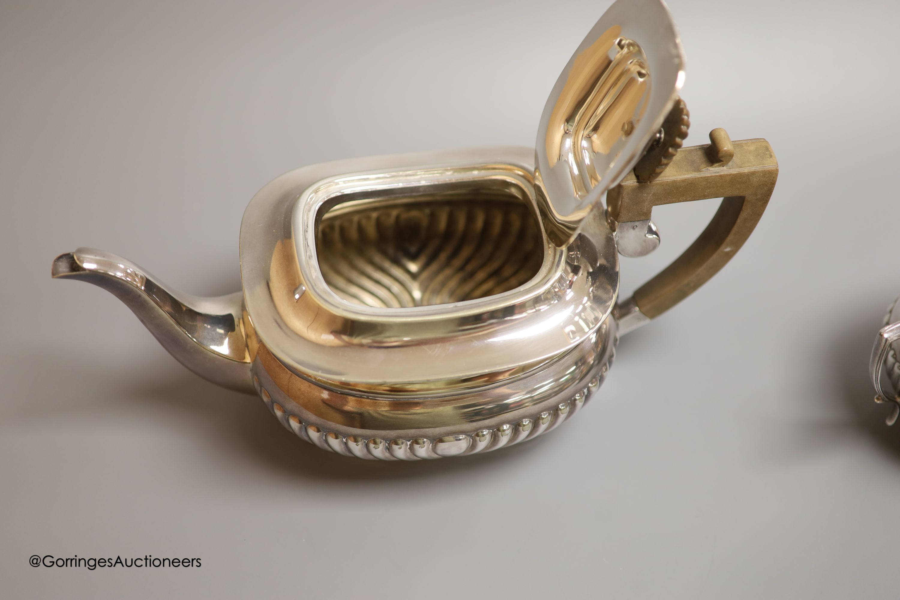 Assorted silver and plated wares including a silver mounted glass scent bottle, London, 1899, a similar cased christening trio, silver pill boxes, teaspoons and vesta case, plated tea set and minor items.
